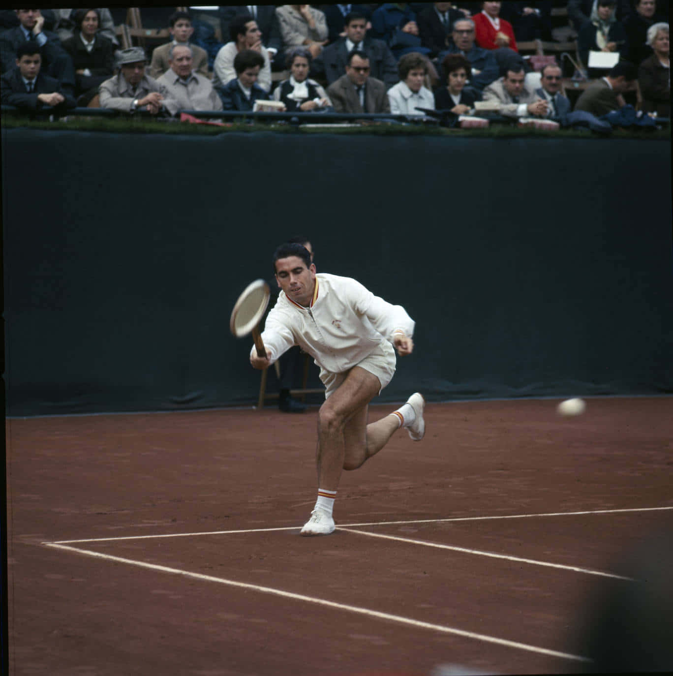 Legendary Tennis Champion Manuel Santana In Action Wallpaper