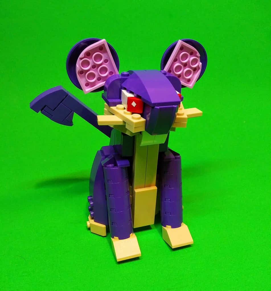 Lego Pokemon Rattata Standing On A Green Backdrop Wallpaper