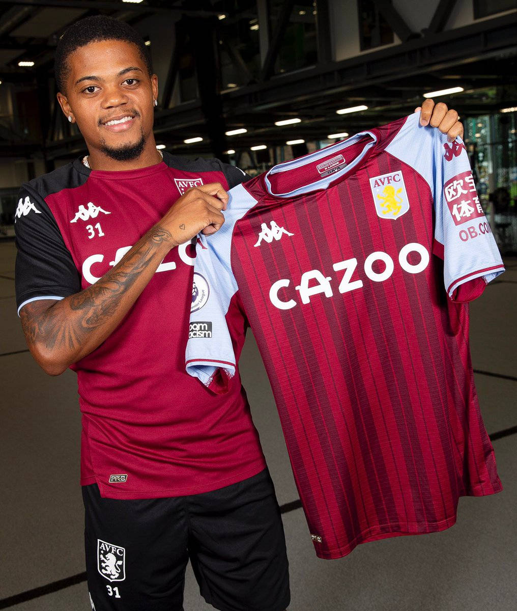 Leon Bailey Holding Aston Villa Jersey Wallpaper