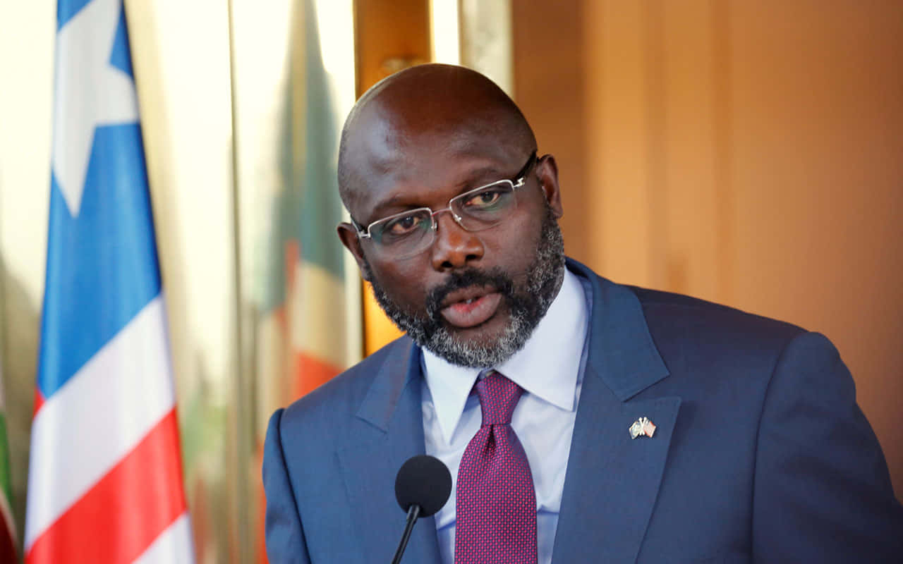 Liberian President George Weah Delivering A Speech Wallpaper