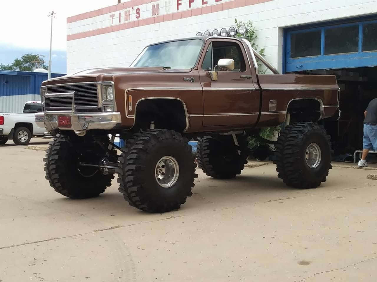 Lifted Square Body Truck Brown Wallpaper