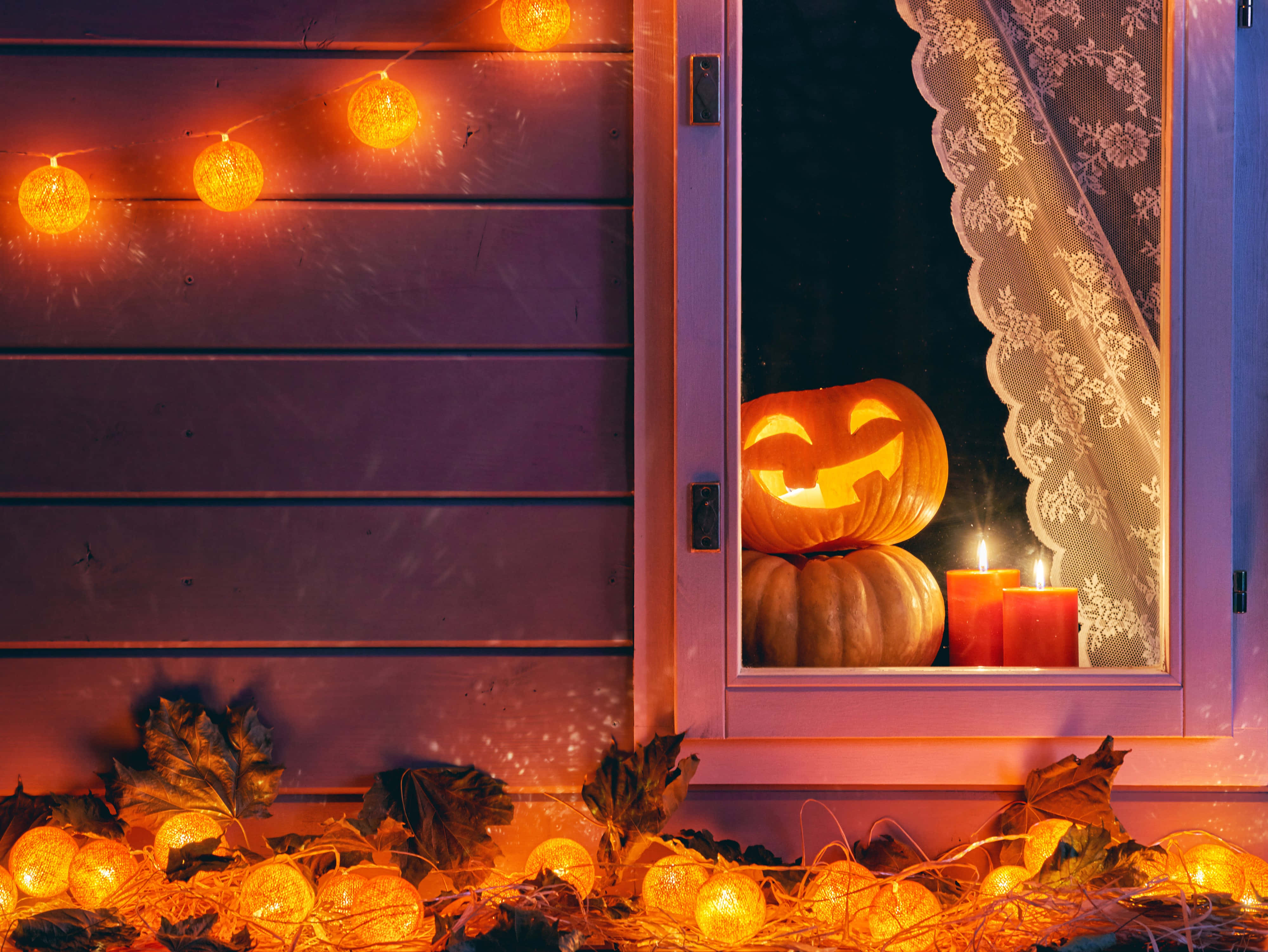 Light Up Your Halloween Celebration With Festive Candles! Wallpaper