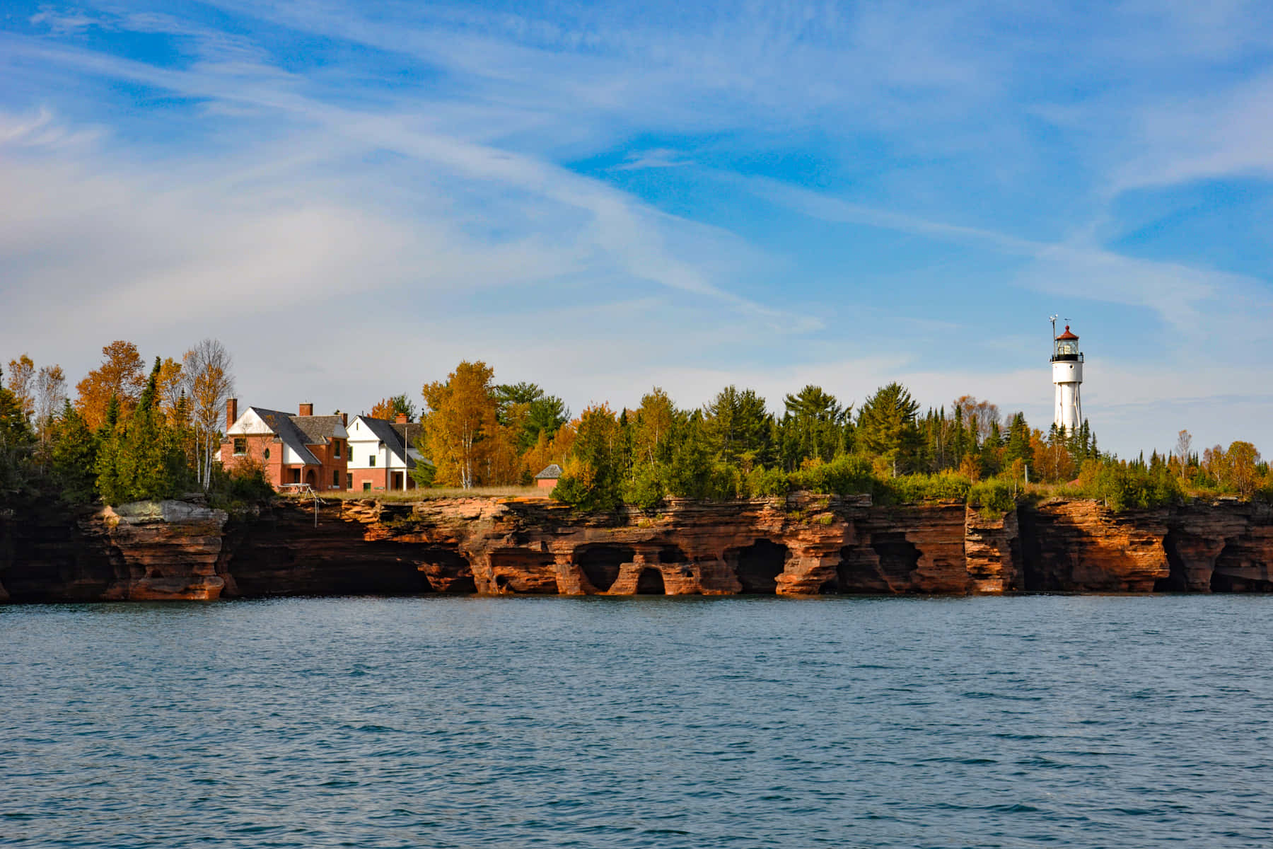 Lighthouse_on_ Cliffside_by_ Water Wallpaper