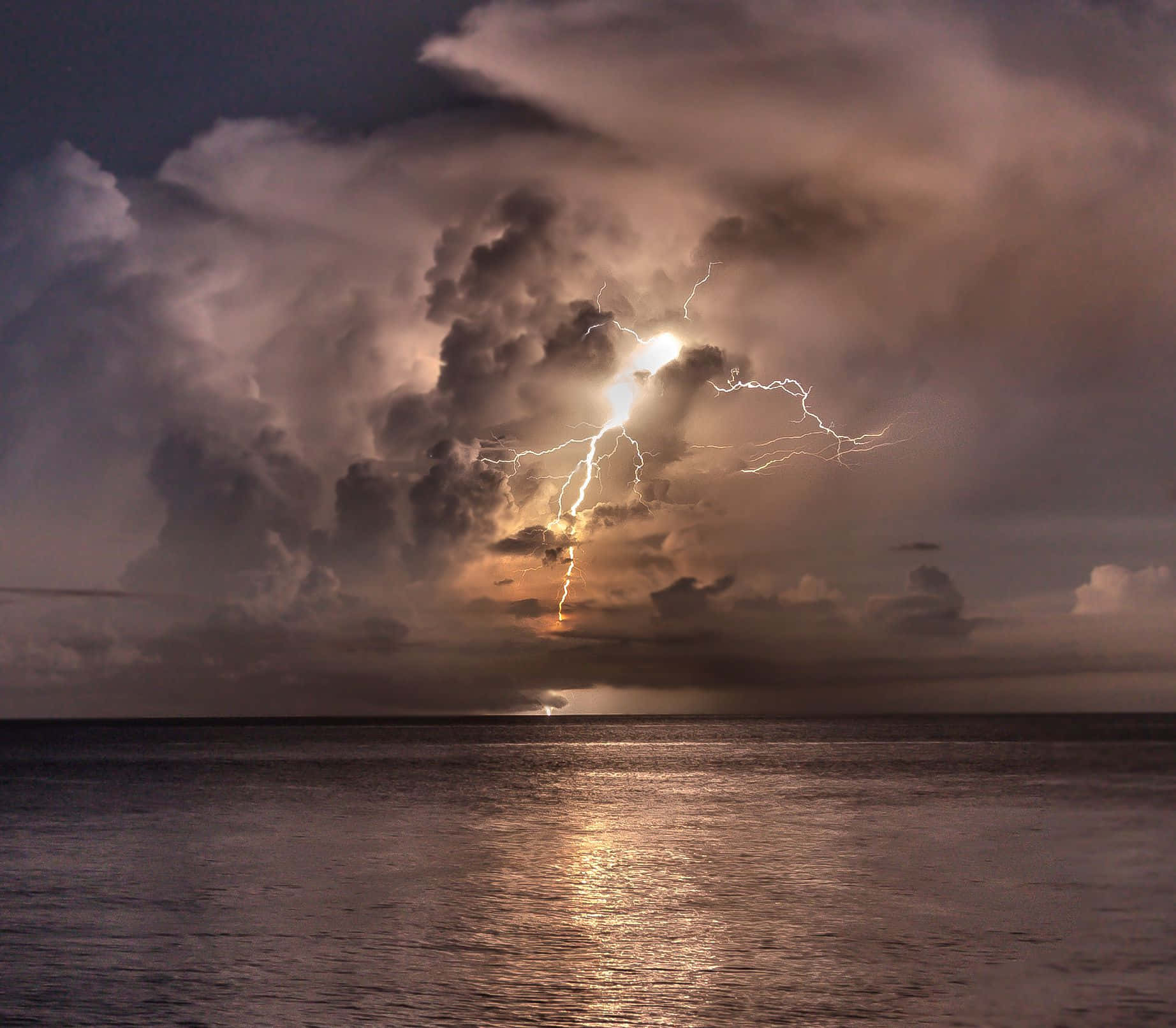 Lightning_ Storm_ Over_ Ocean_ Moonlit Wallpaper