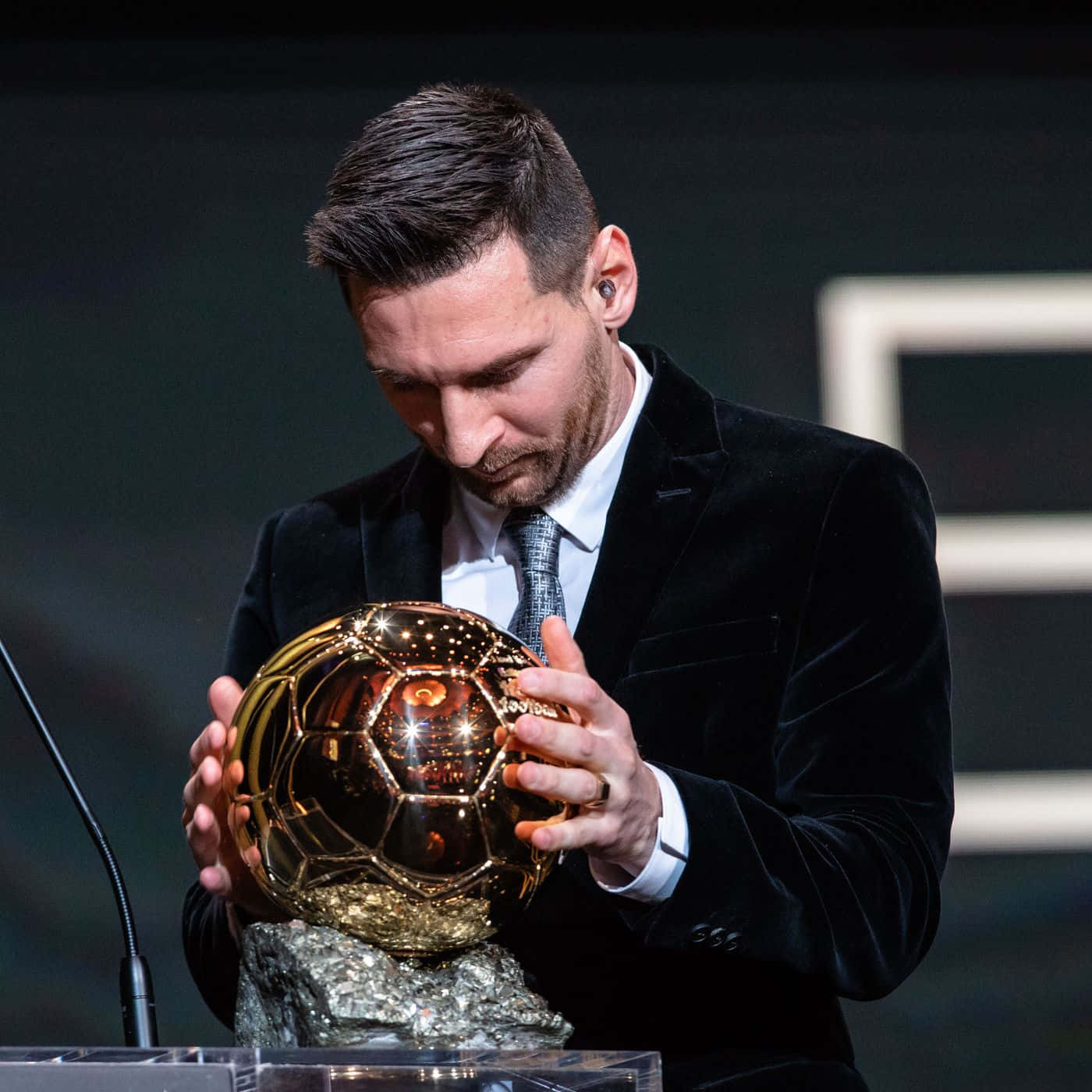 Lionel Messi With His Ballon D'or Award Wallpaper