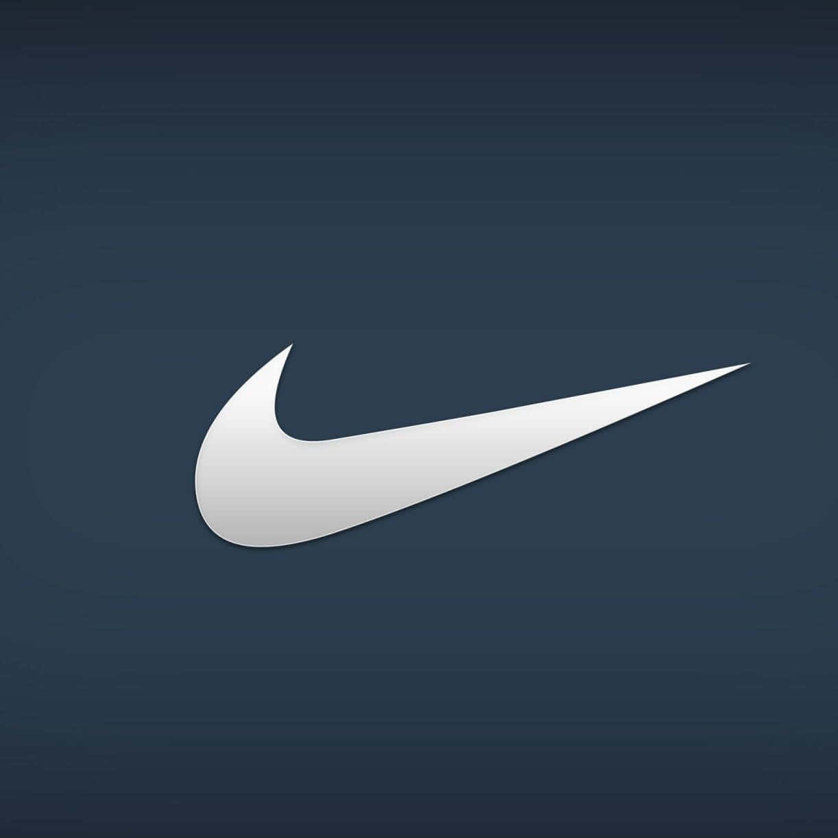 Logo Of Nike Featuring The Signature Swoosh In Bright Blue Wallpaper