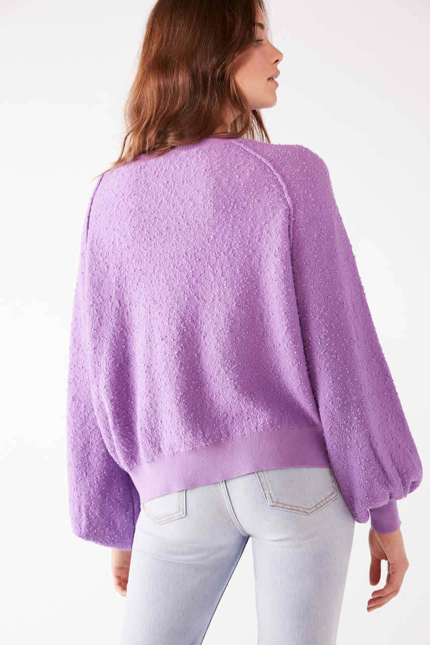 Look Cool And Keep Warm In This Trendy Purple Sweatshirt. Wallpaper