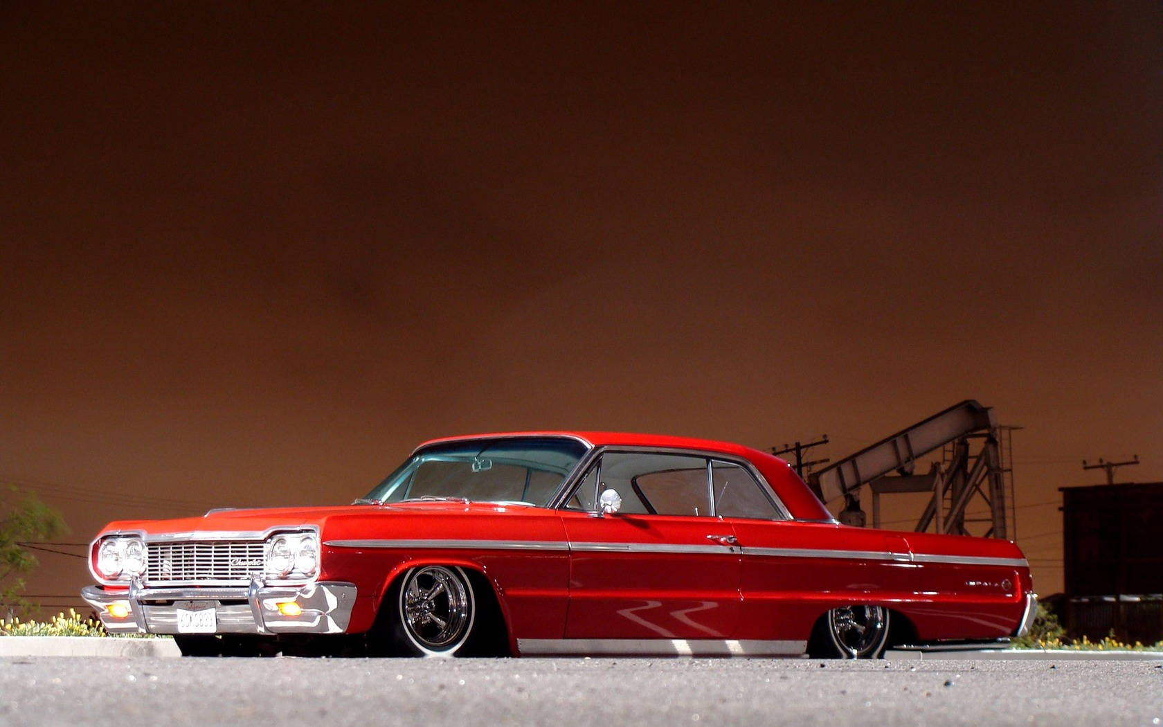 Lowrider Impala Against Brown Sky Wallpaper