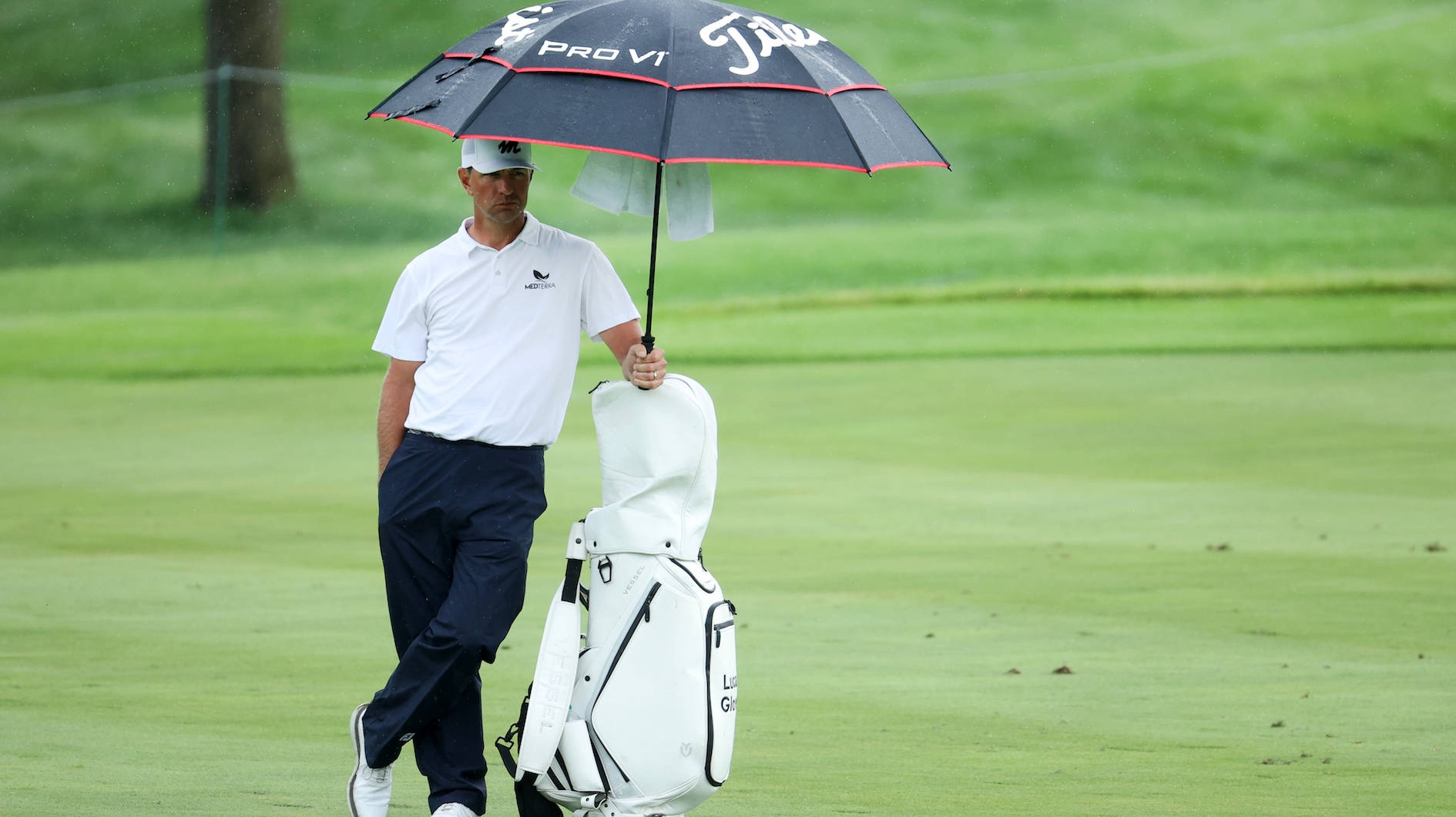 Lucas Glover Holding Umbrella Wallpaper