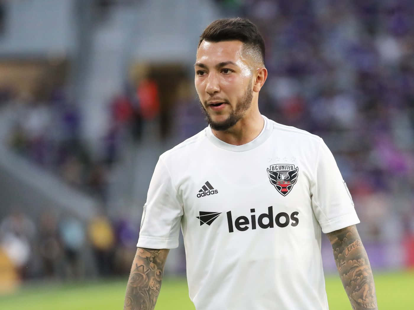 Luciano Acosta In His White Leidos Football Jersey Wallpaper