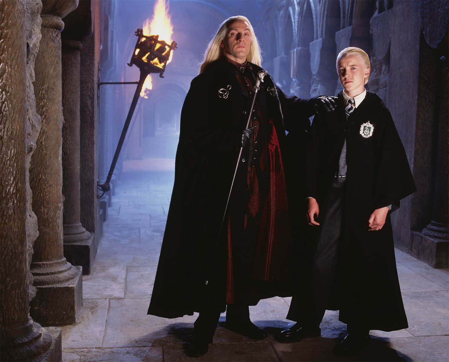 Luciusand Draco Malfoyin Hogwarts Corridor Wallpaper