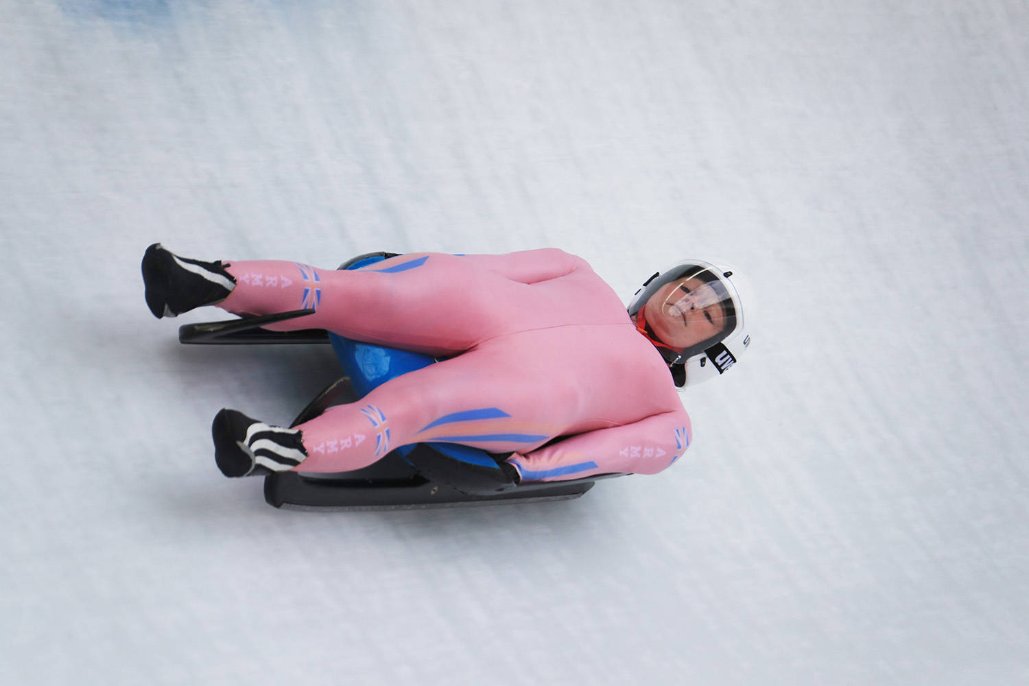 Lucy Wyatt In Pink Luge Suit Wallpaper