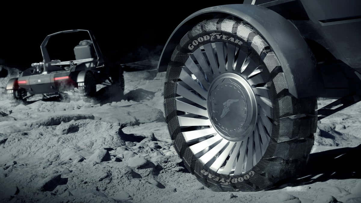 Lunar Rover Exploring The Moon's Surface During An Apollo Mission Wallpaper