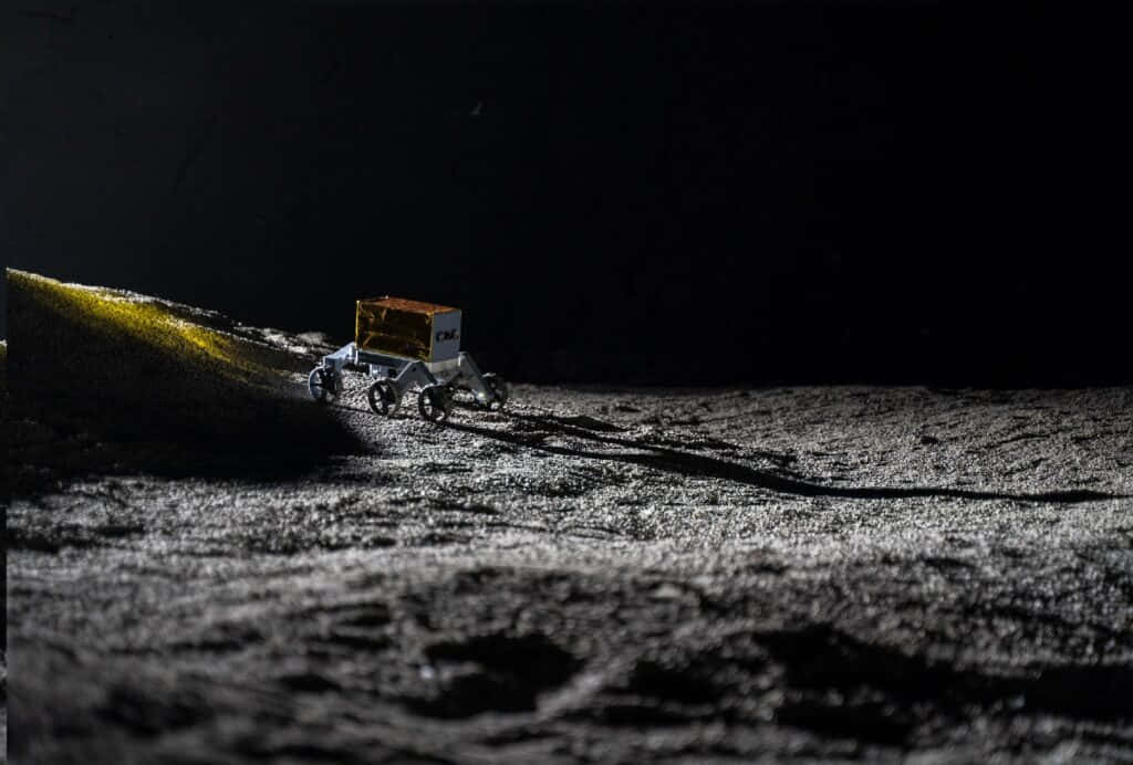 Lunar Rover Exploring The Moon's Surface Wallpaper