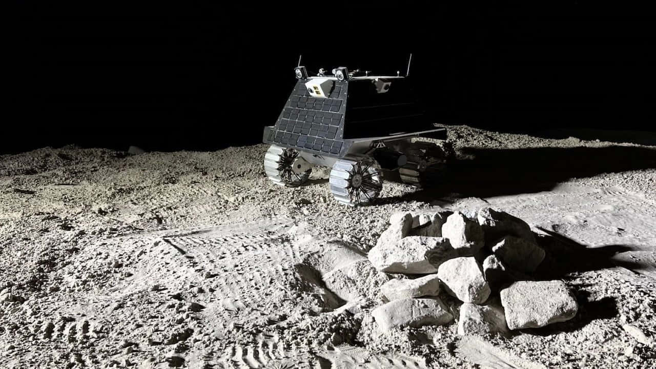 Lunar Rover Exploring The Moon's Surface Wallpaper