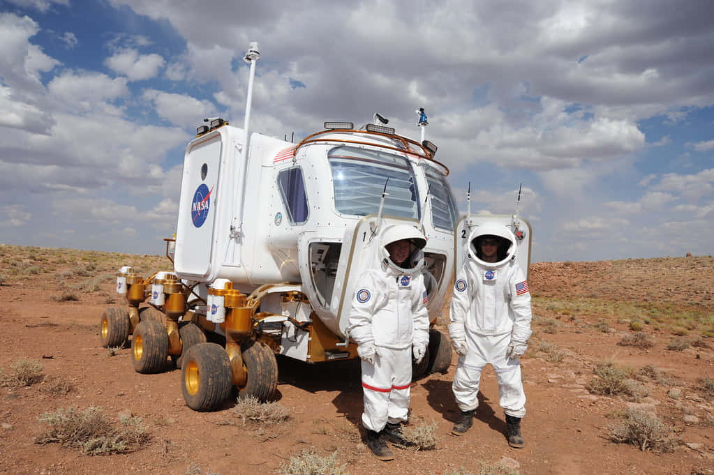 Lunar Rover Traversing The Moon's Surface Wallpaper