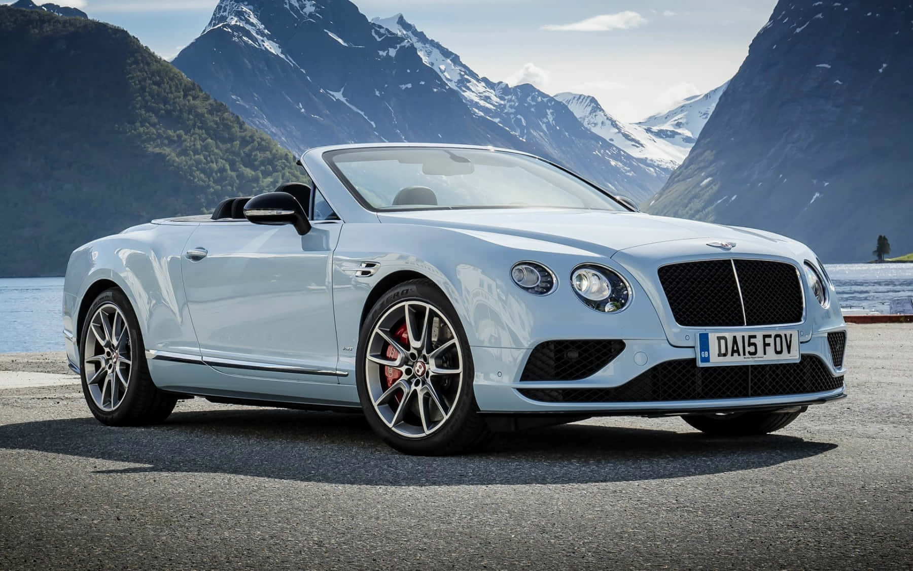 Luxurious Bentley Continental Gt Posing On An Open Road Wallpaper