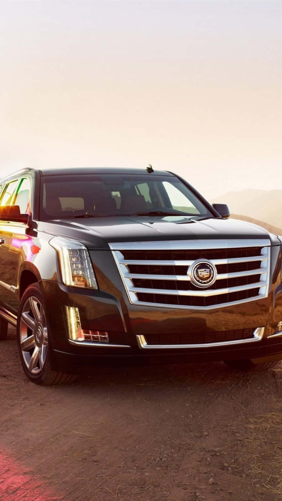 Luxurious Cadillac Escalade On The Go Wallpaper