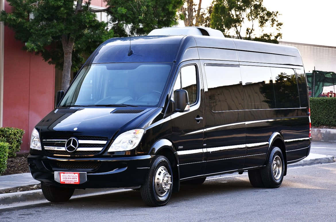 Luxurious Mercedes Benz Sprinter Van On The Move Wallpaper