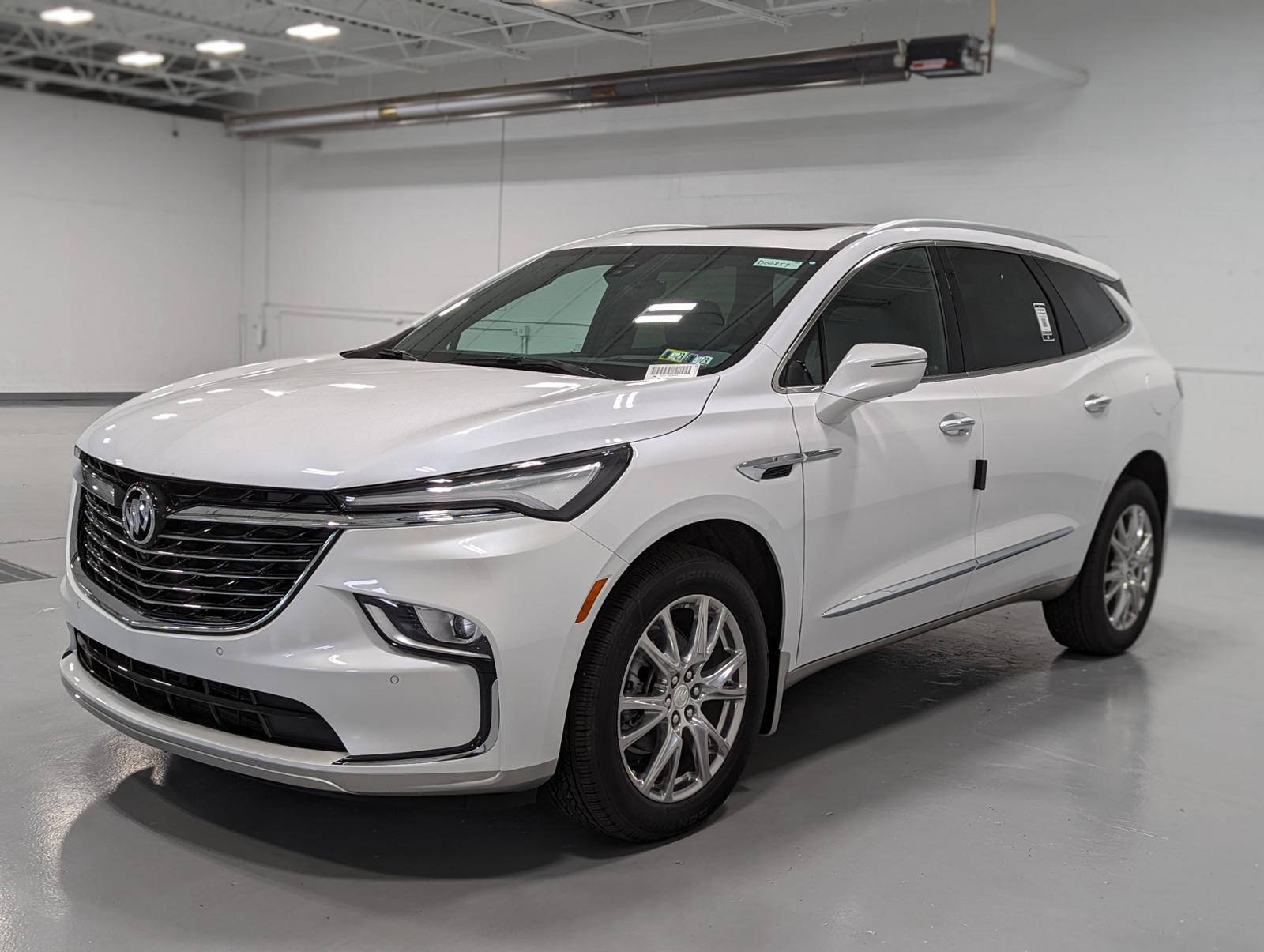 Luxurious White Buick Enclave Showcased In A Showroom Wallpaper