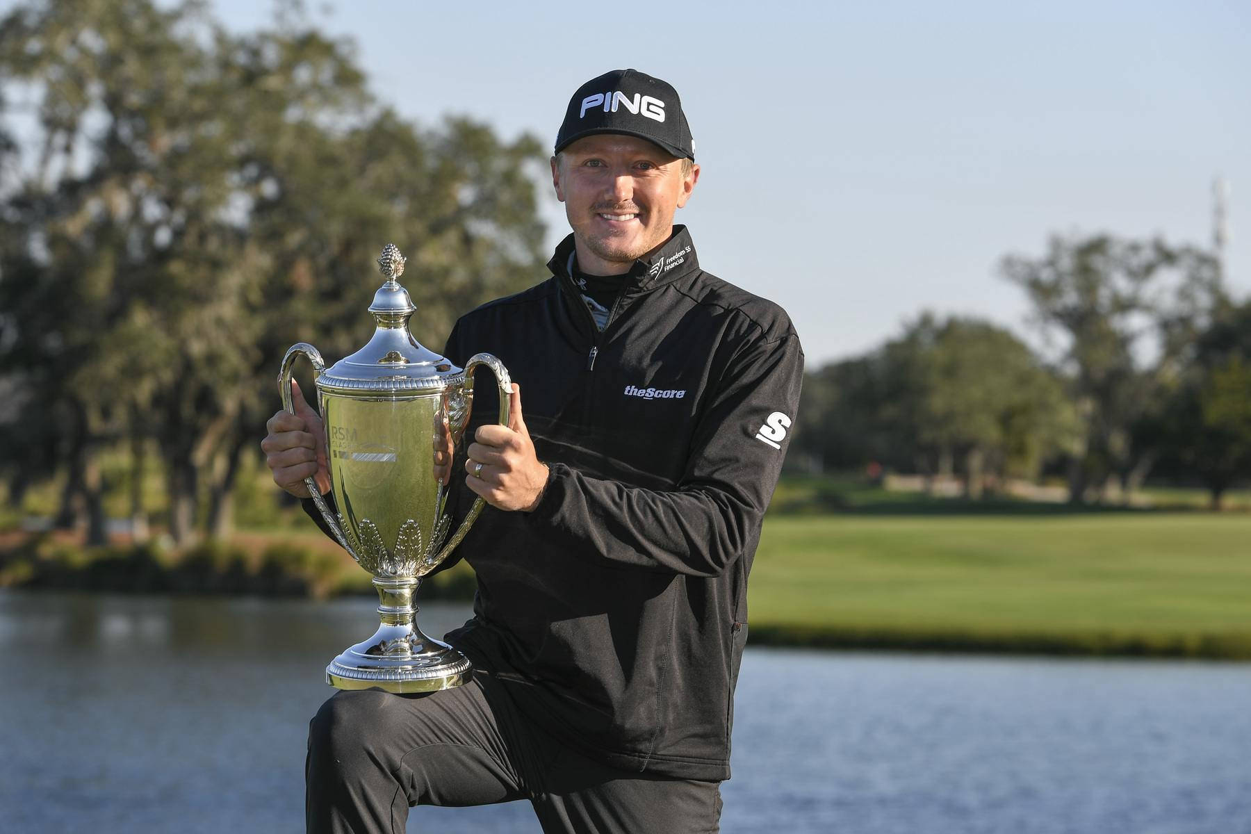 Mackenzie Hughes Holding His Trophy Wallpaper