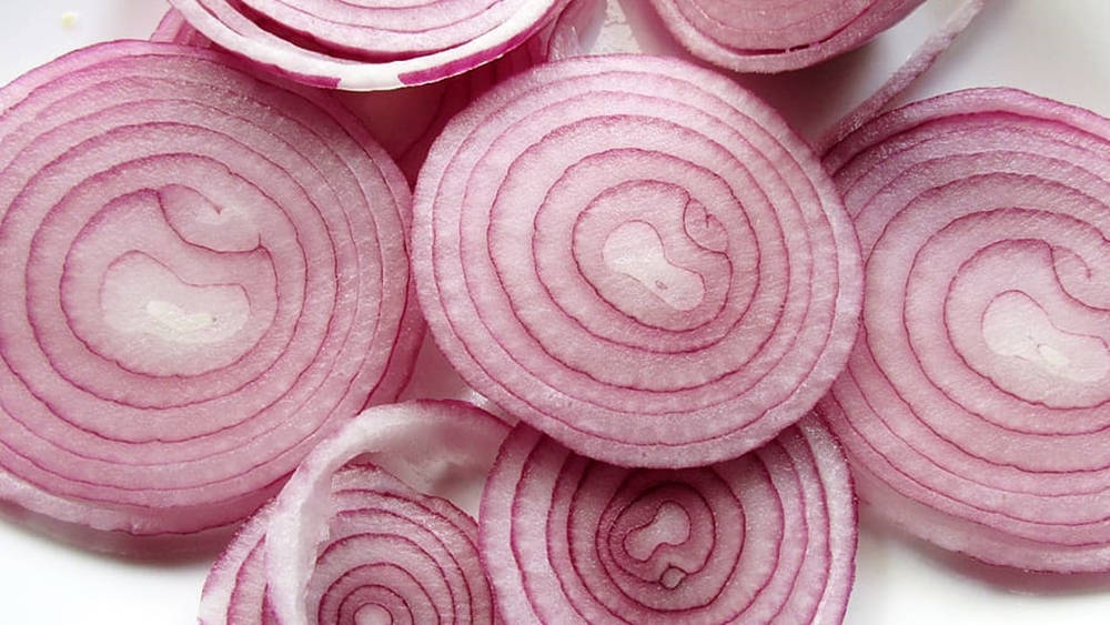 Macro Shot Fresh Sliced Red Onions Wallpaper