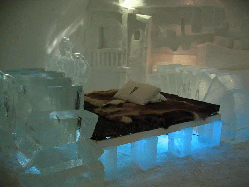 Magical Ice Hotel Suite Illuminated By Glowing Snowflakes Wallpaper