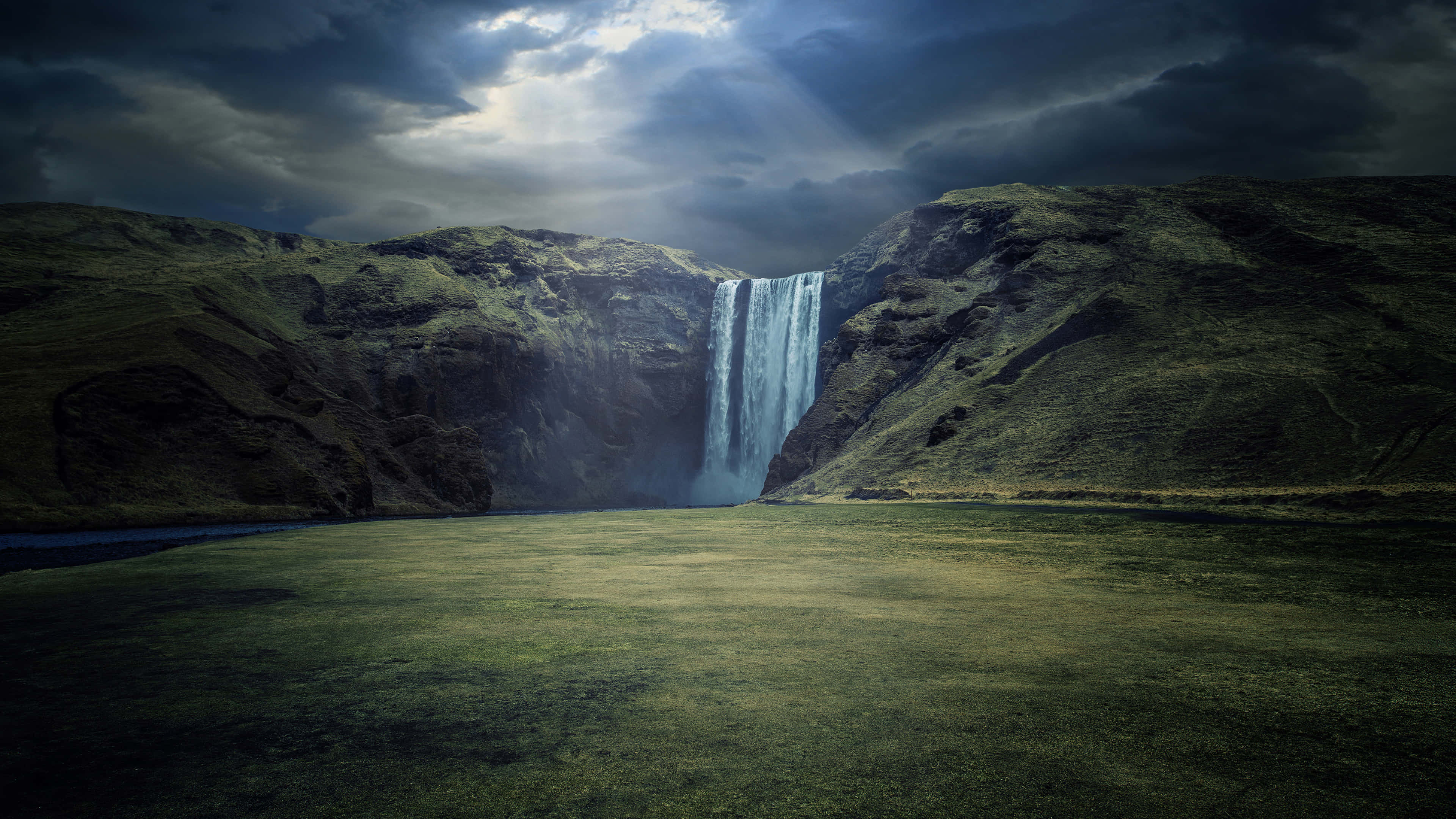 Majestic 4k Waterfall In Verdant Wilderness Wallpaper