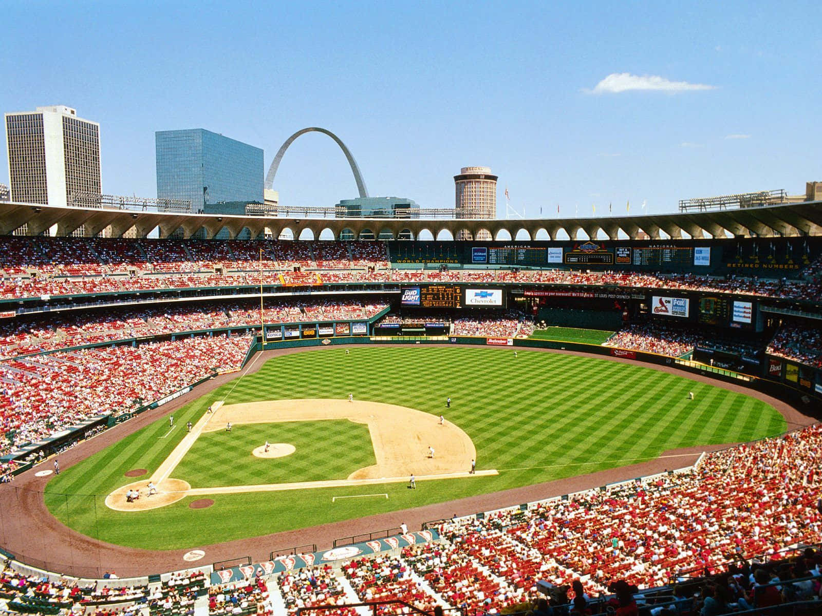 Majestic Baseball Stadium Under A Clear Blue Sky Wallpaper