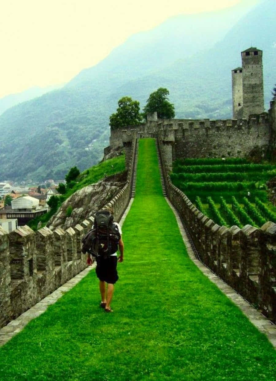 Majestic Castle Of Bellinzona Under The Sunlit Sky Wallpaper