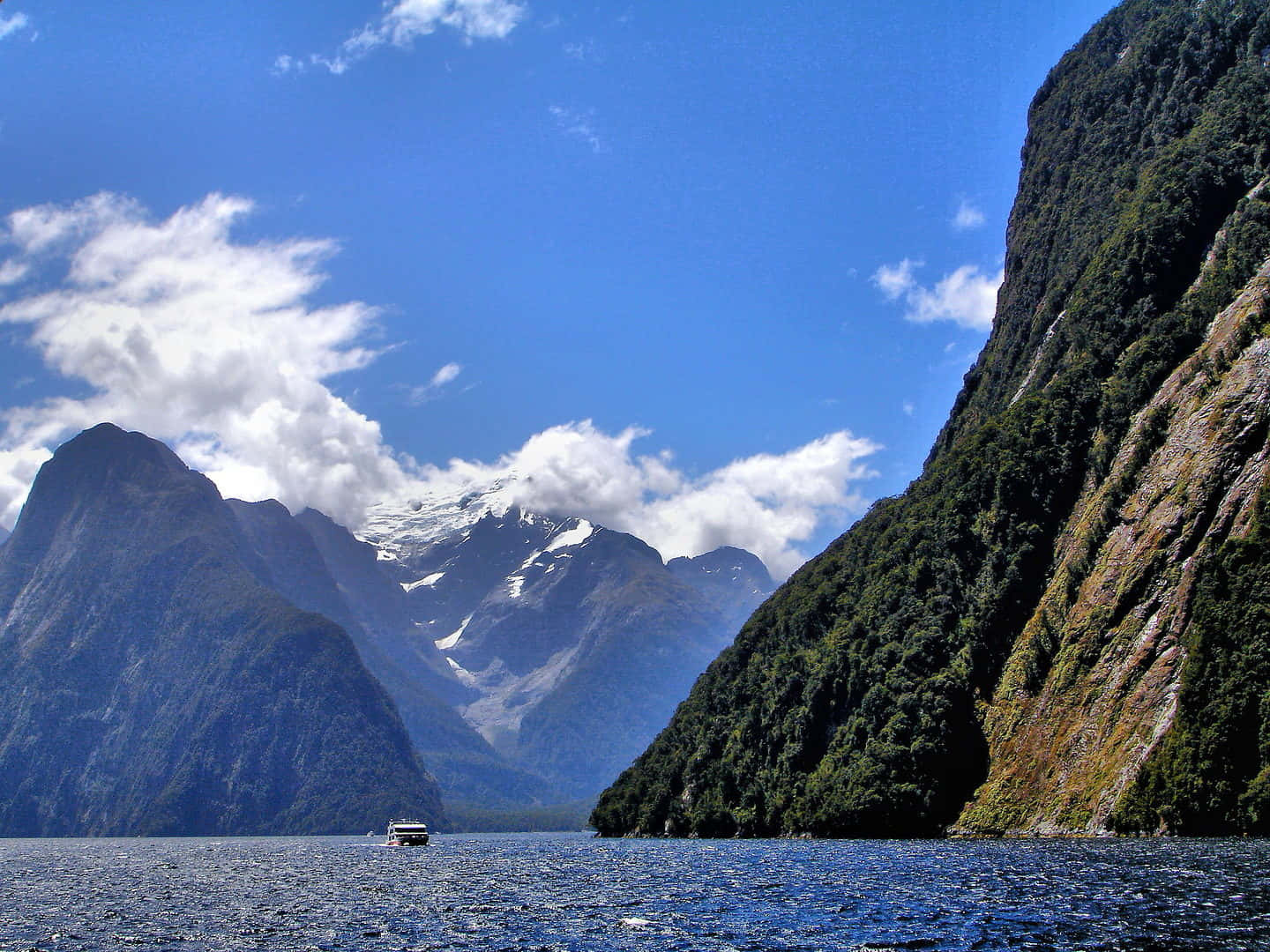 Majestic Clouds Enhancing Milford Sound Tranquility Wallpaper