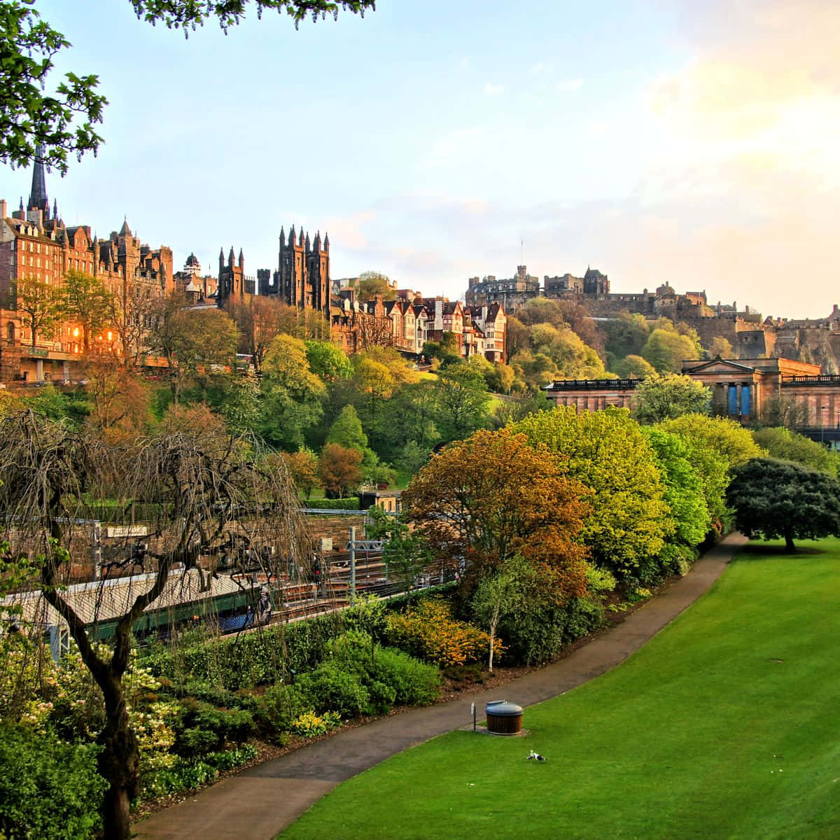 Majestic Edinburgh Castle Dominating The City Skyline Wallpaper