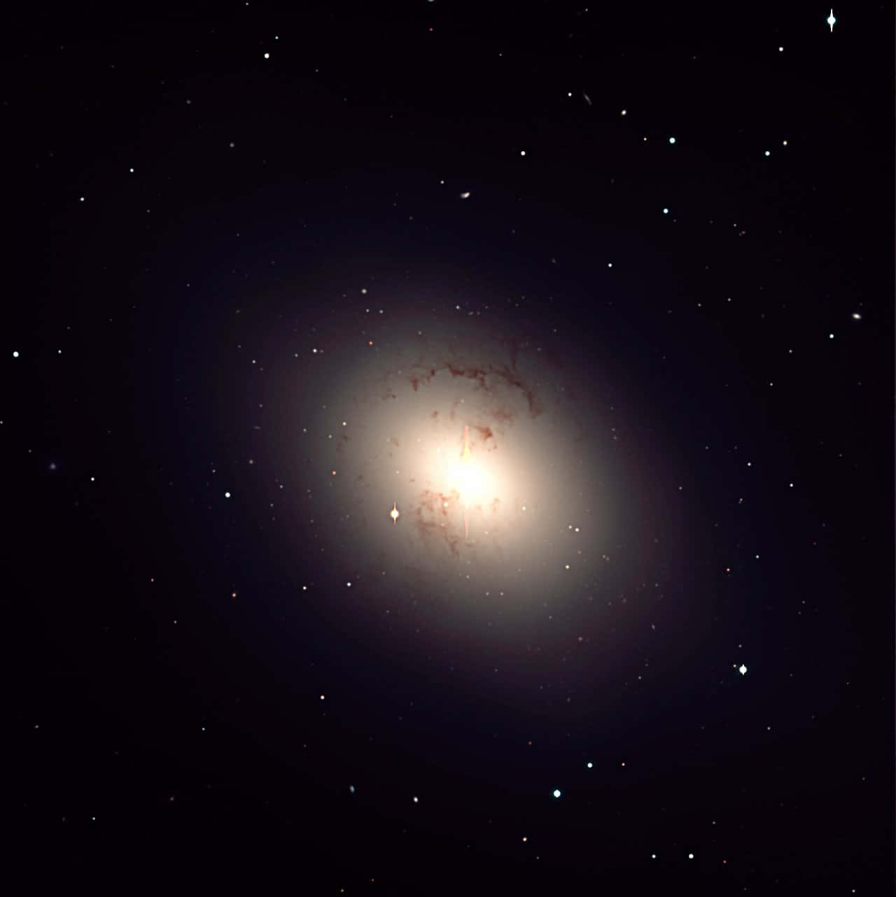 Majestic Elliptical Galaxy In Deep Space Wallpaper