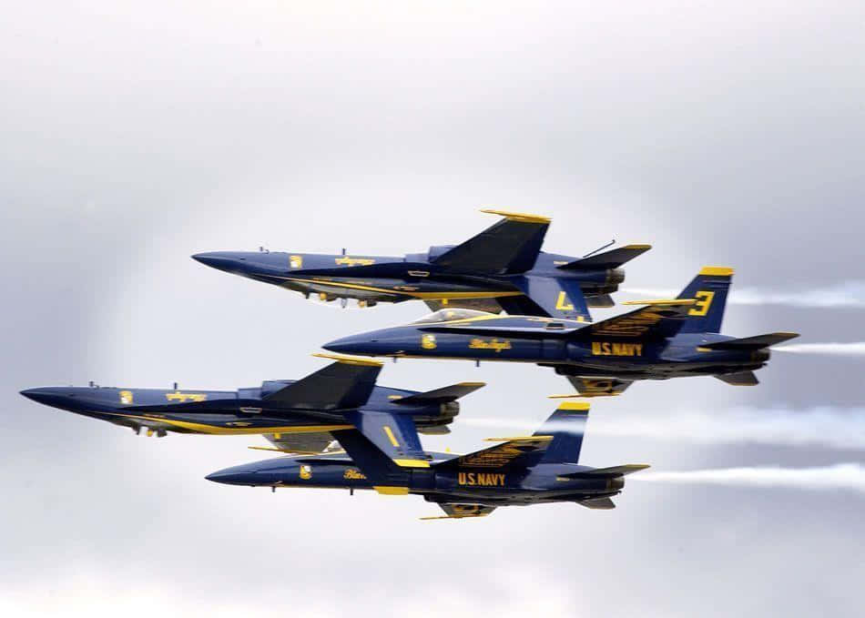 Majestic Formation Of Blue Angels In Sky Wallpaper