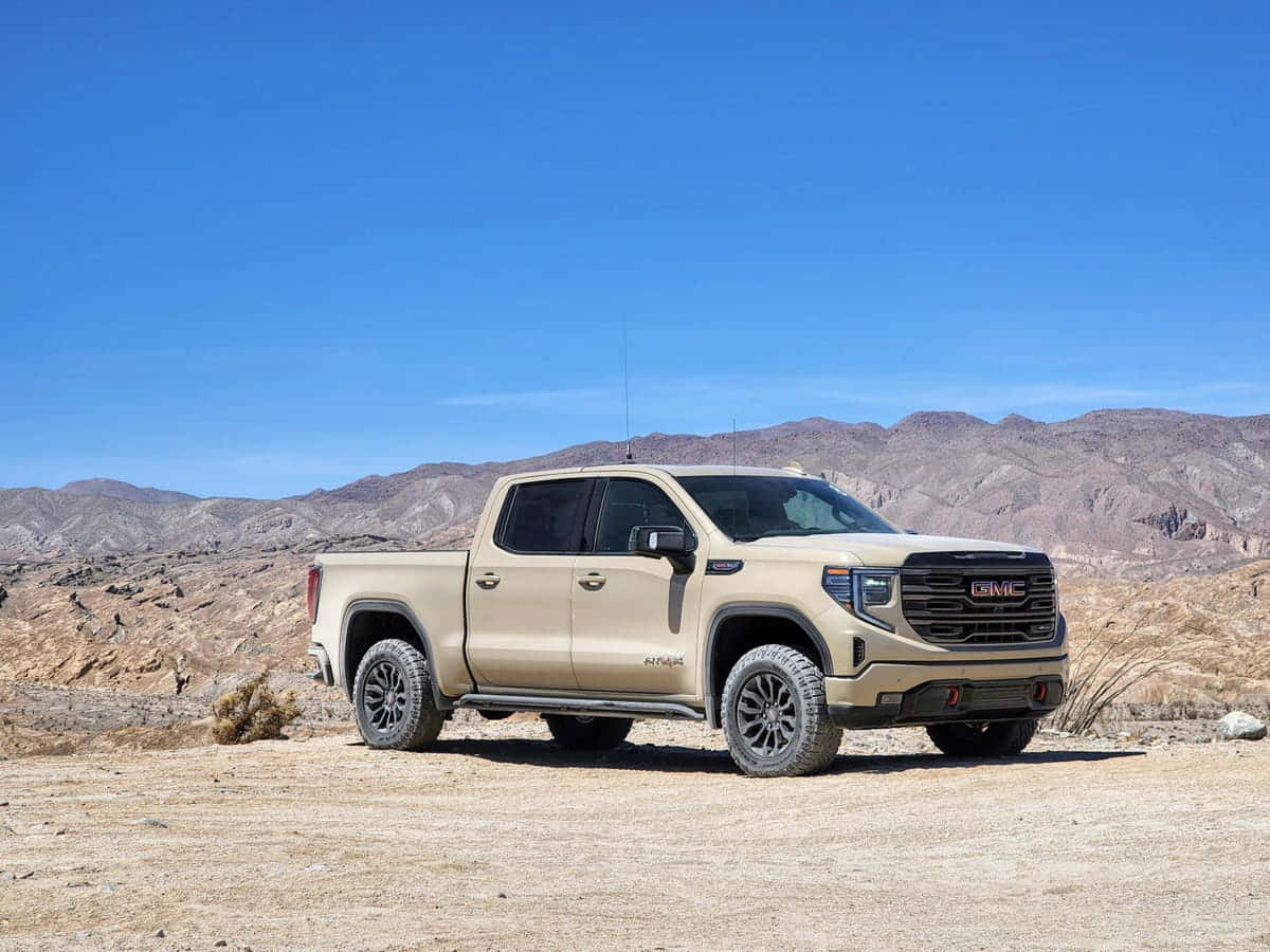 Majestic Gmc Sierra On Scenic Road Wallpaper