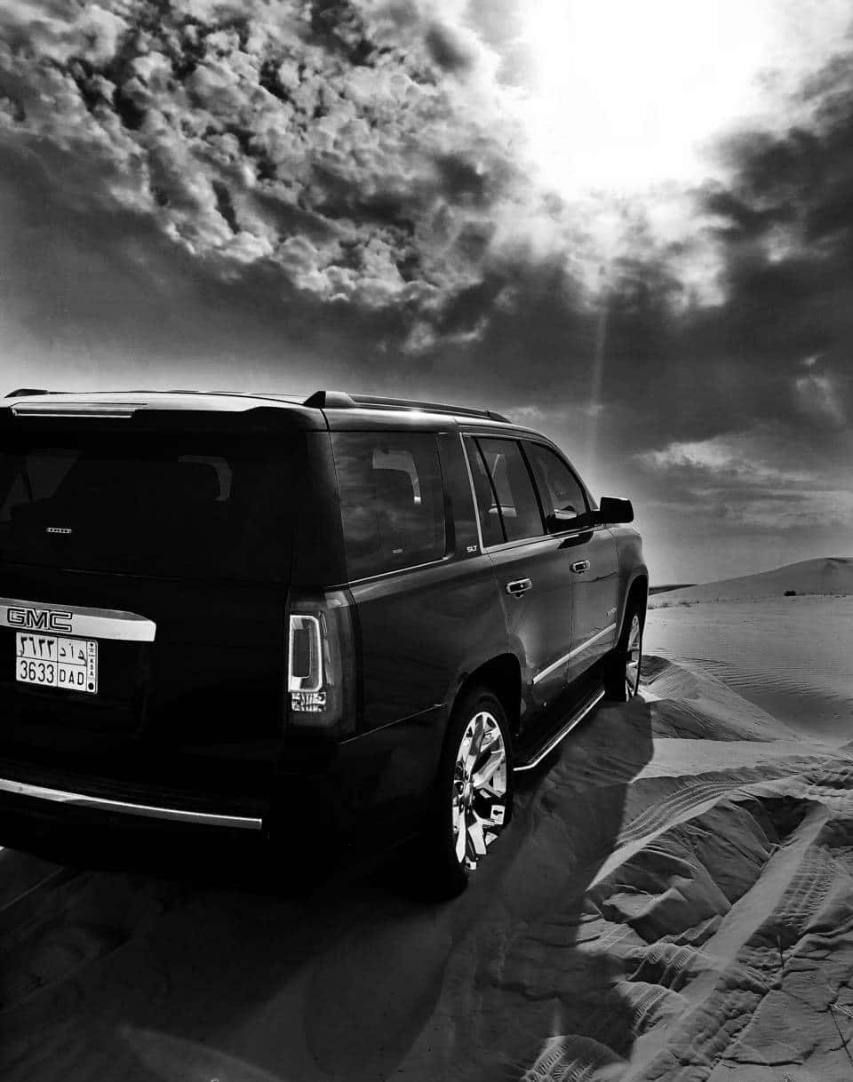 Majestic Gmc Yukon Showcasing Its Sleek Design And Powerful Stance Wallpaper