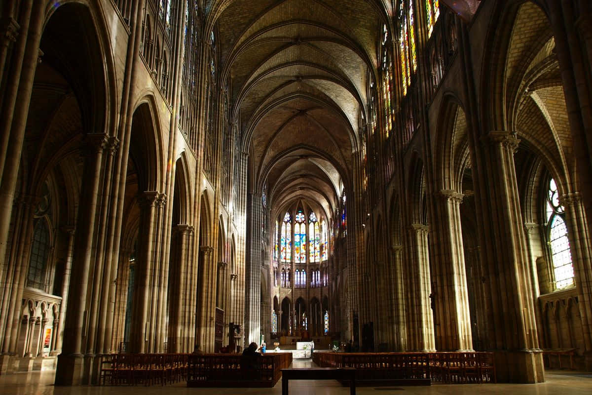 Majestic Gothic Cathedral With Intricate Stonework And Soaring Arched Windows Wallpaper