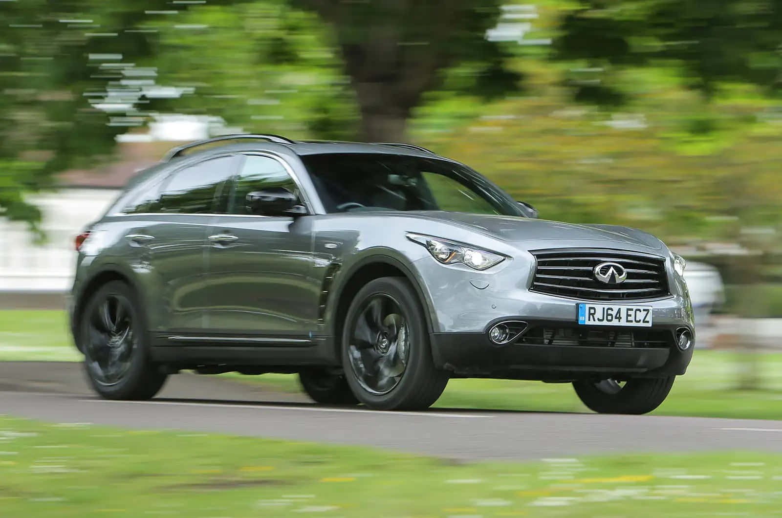 Majestic Infiniti Qx70 Gliding Through The Highway Wallpaper