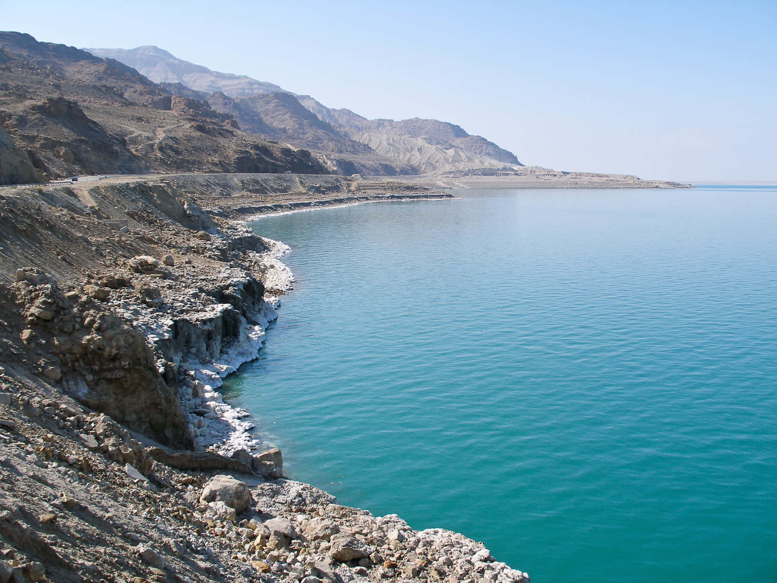 Majestic Low-hanging Rocky Cliff By The Dead Sea Wallpaper