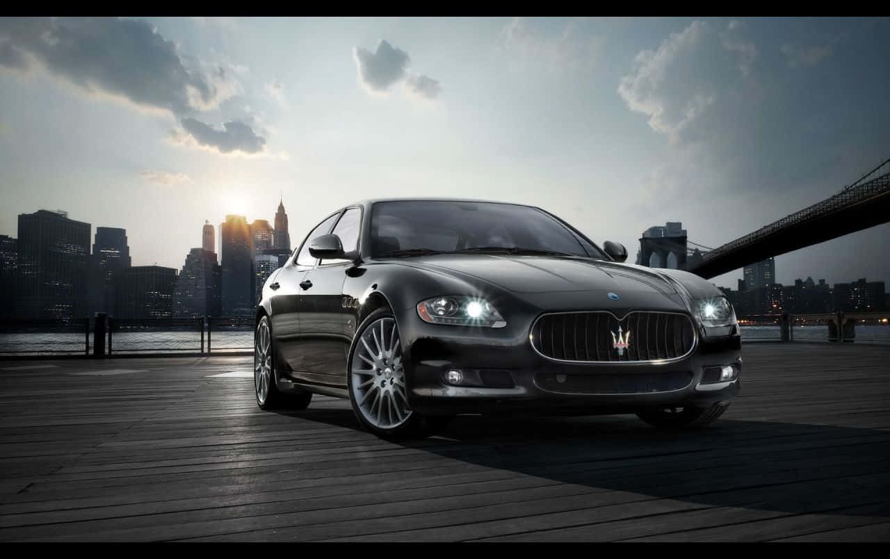 Majestic Maserati Quattroporte In Action Wallpaper