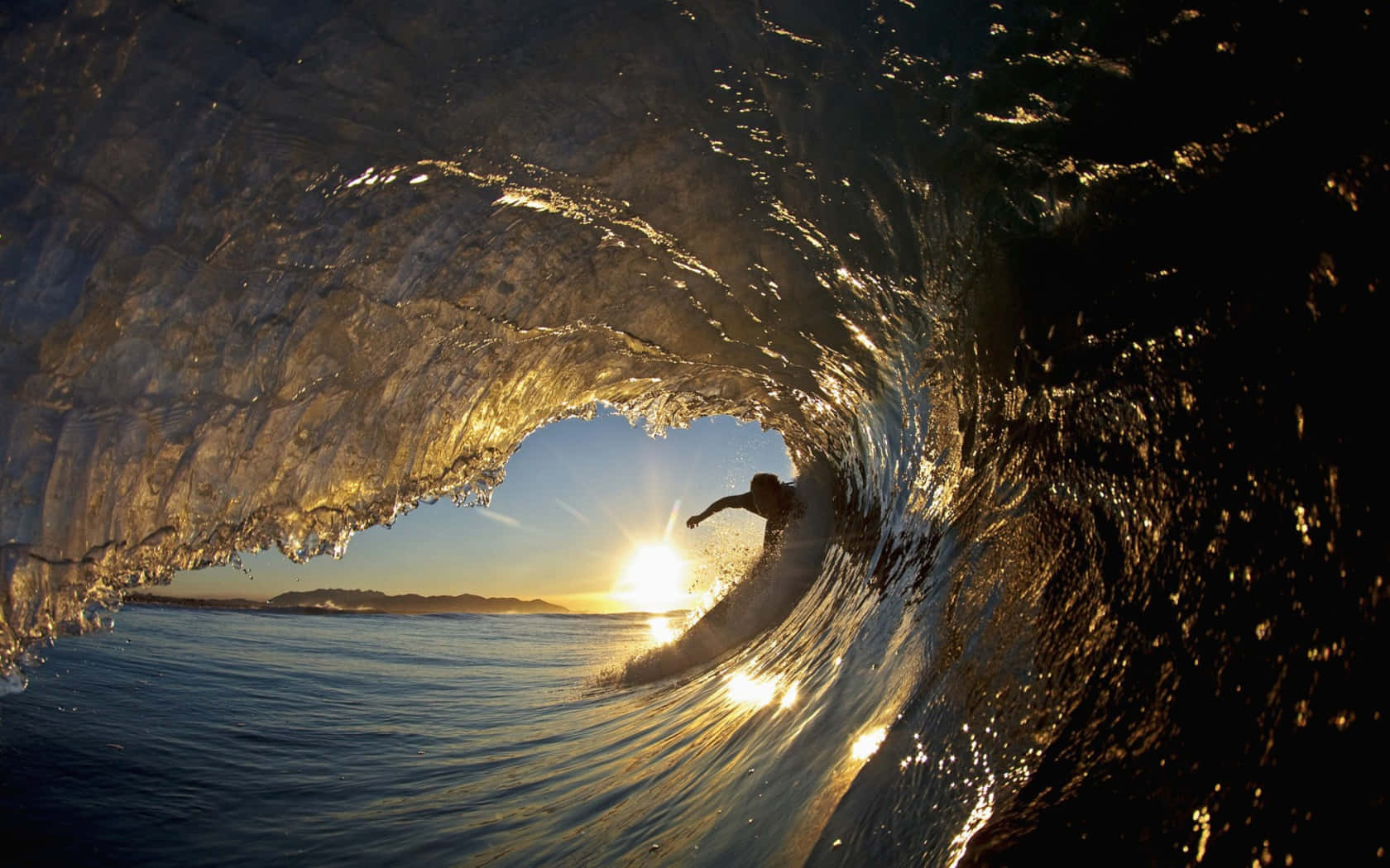 Majestic Ocean Tides At Sunset Wallpaper