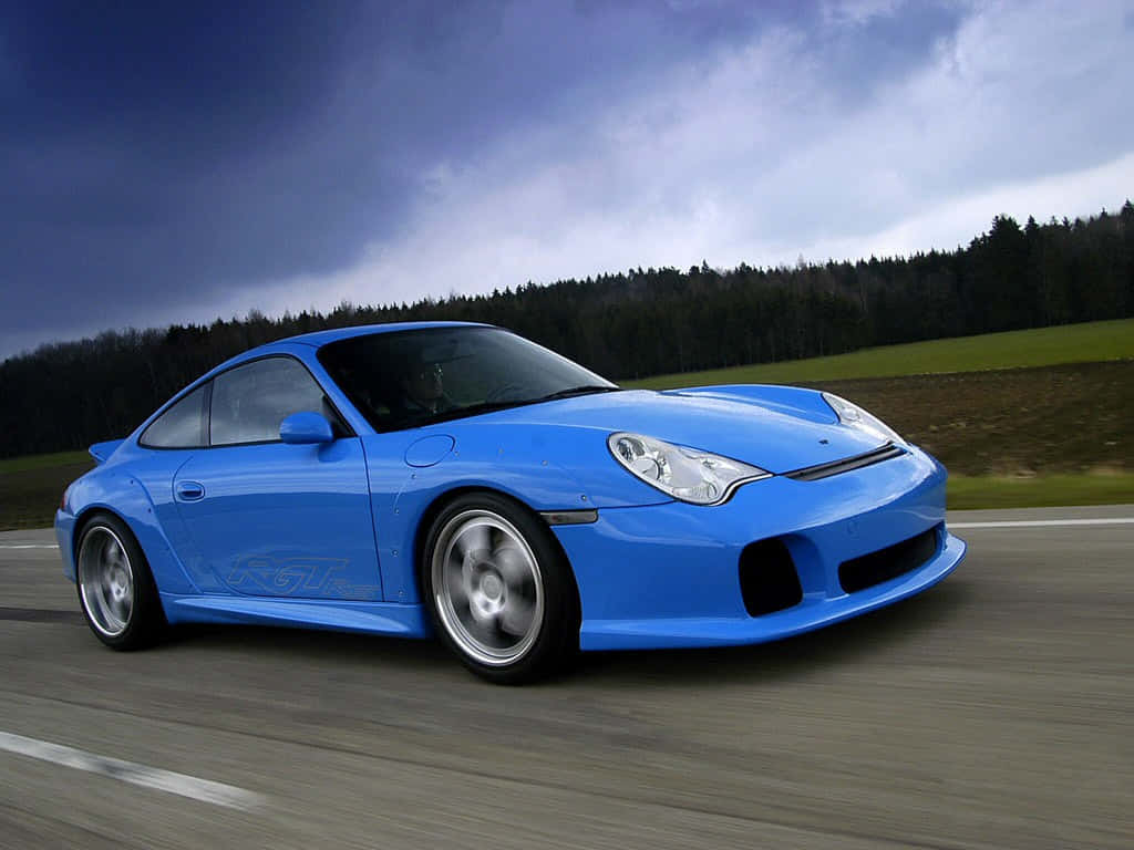 Majestic Porsche 996 Gliding On The Highway Wallpaper