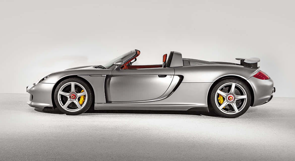 Majestic Porsche Carrera Gt In A Stunning Environment Wallpaper