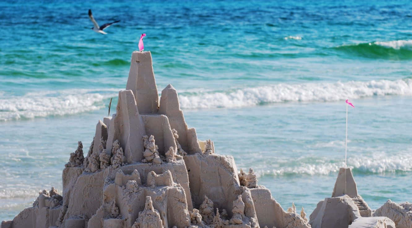 Majestic Sandcastles On A Sunny Beach Wallpaper