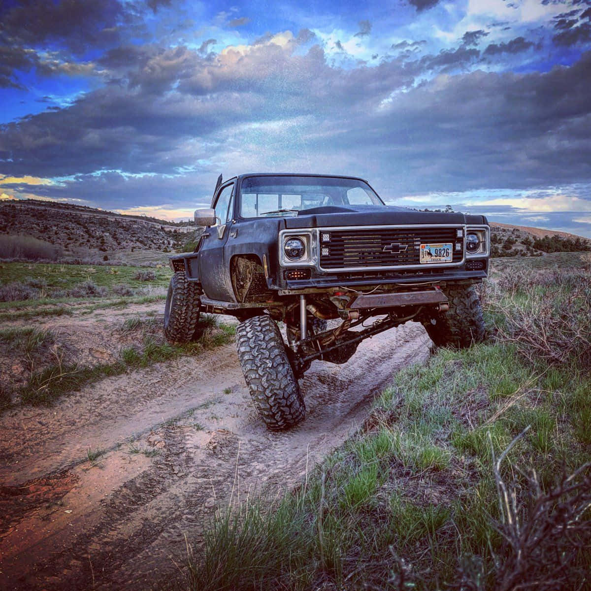 Majestic Square Body Truck Against A Mountainous Landscape Wallpaper