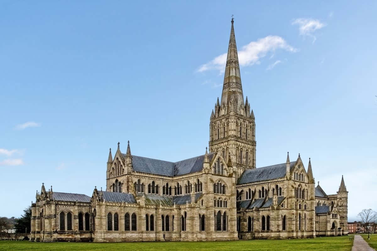 Majestic Sunset Over The Iconic Salisbury Cathedral Wallpaper