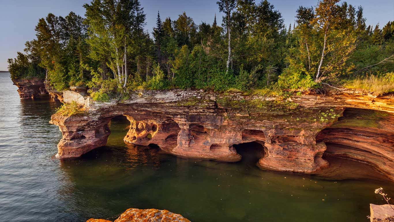 Majestic View Of Devils Island At Sunset Wallpaper