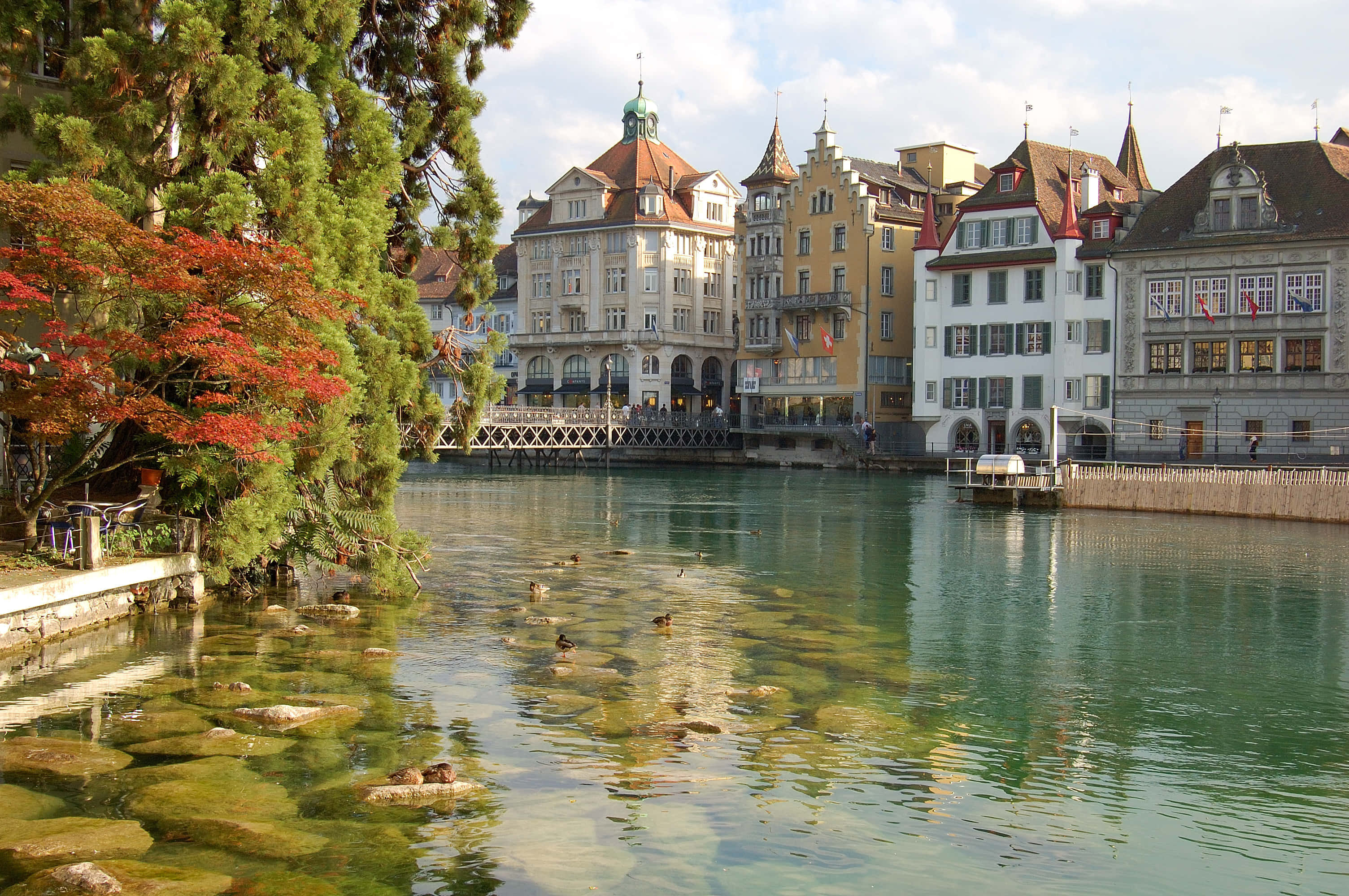 Majestic View Of Lake Lucerne Surrounded By Mountains Wallpaper