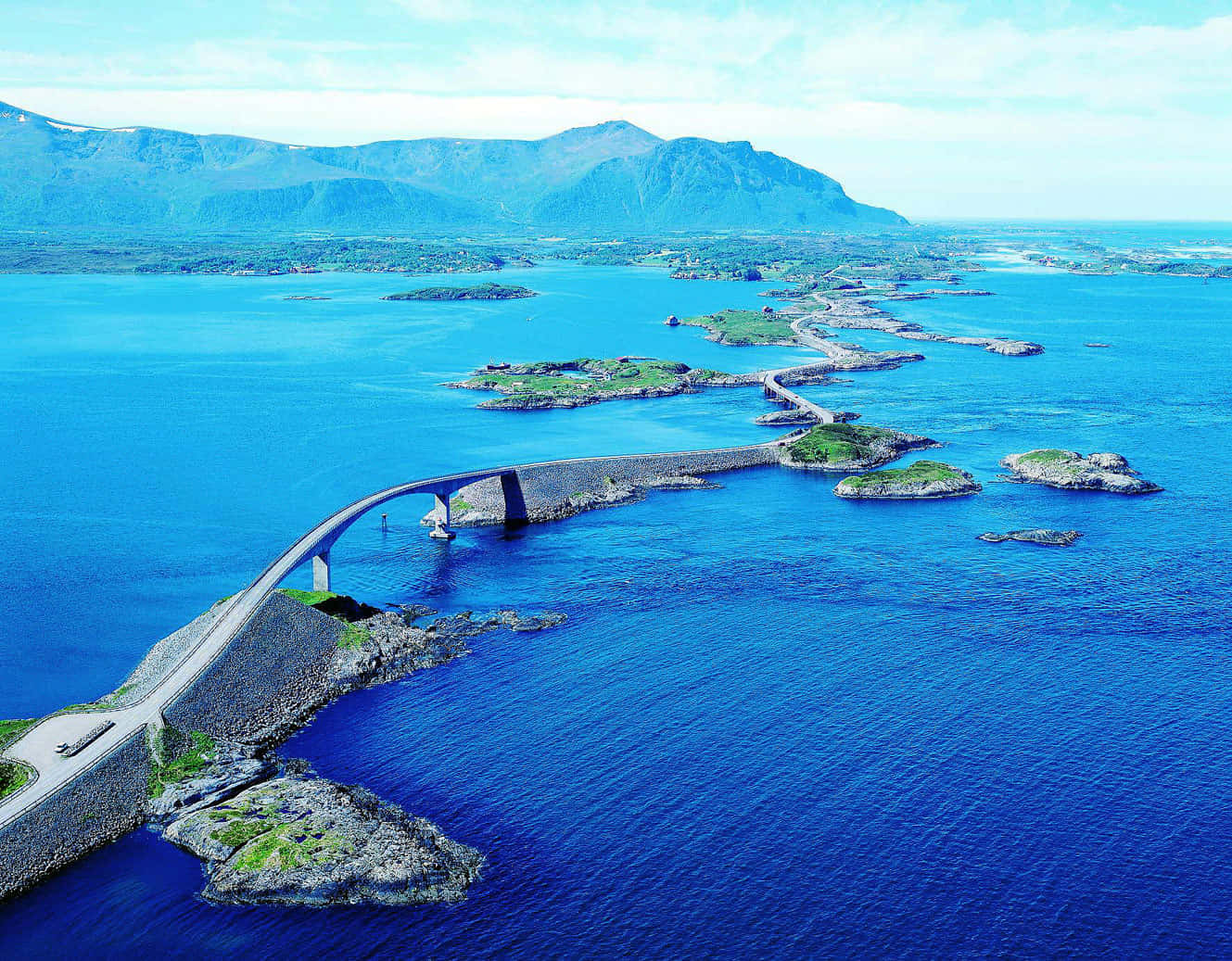 Majestic View Of The Storseisundet Bridge Across The Serene Waterfront Wallpaper