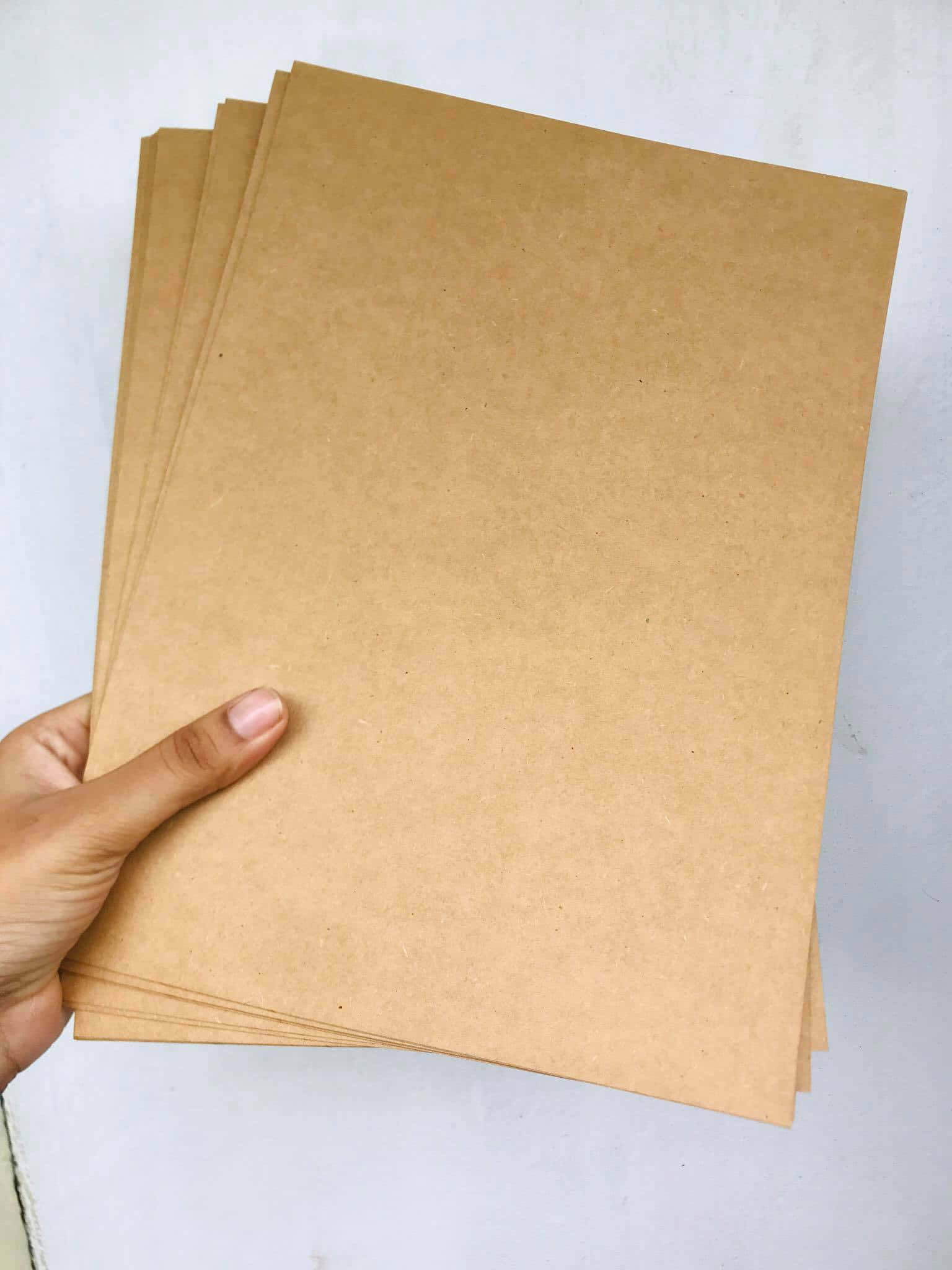 Man Holding A Large Sheet Of Transparent Plexiglass Wallpaper